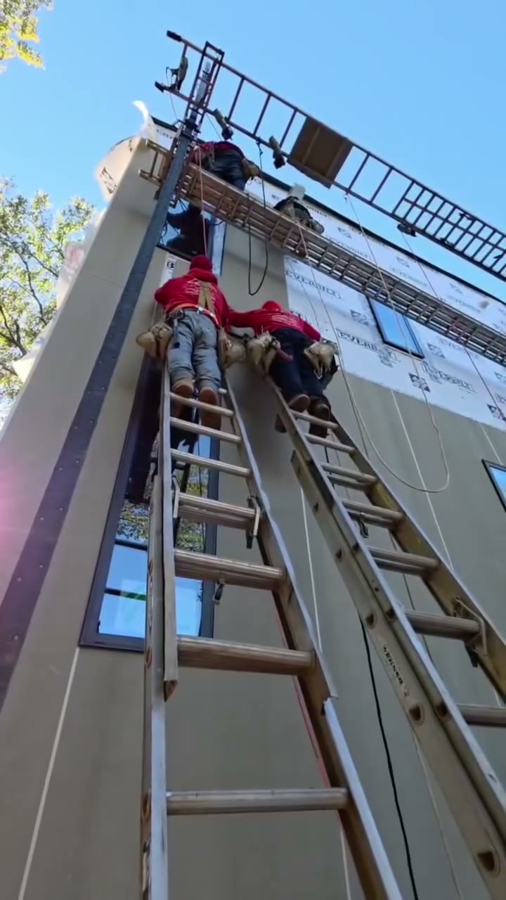 Diaz crew installing siding on a multi-story home — Diaz project