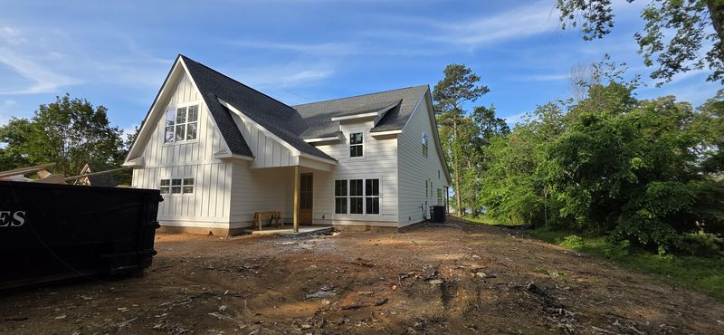 Second view of the white new-build exterior at a construction stage — Diaz project